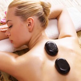 beautiful-woman-relaxing-spa-salon-with-hot-stones-body-beauty-treatment-therapy_186202-8793